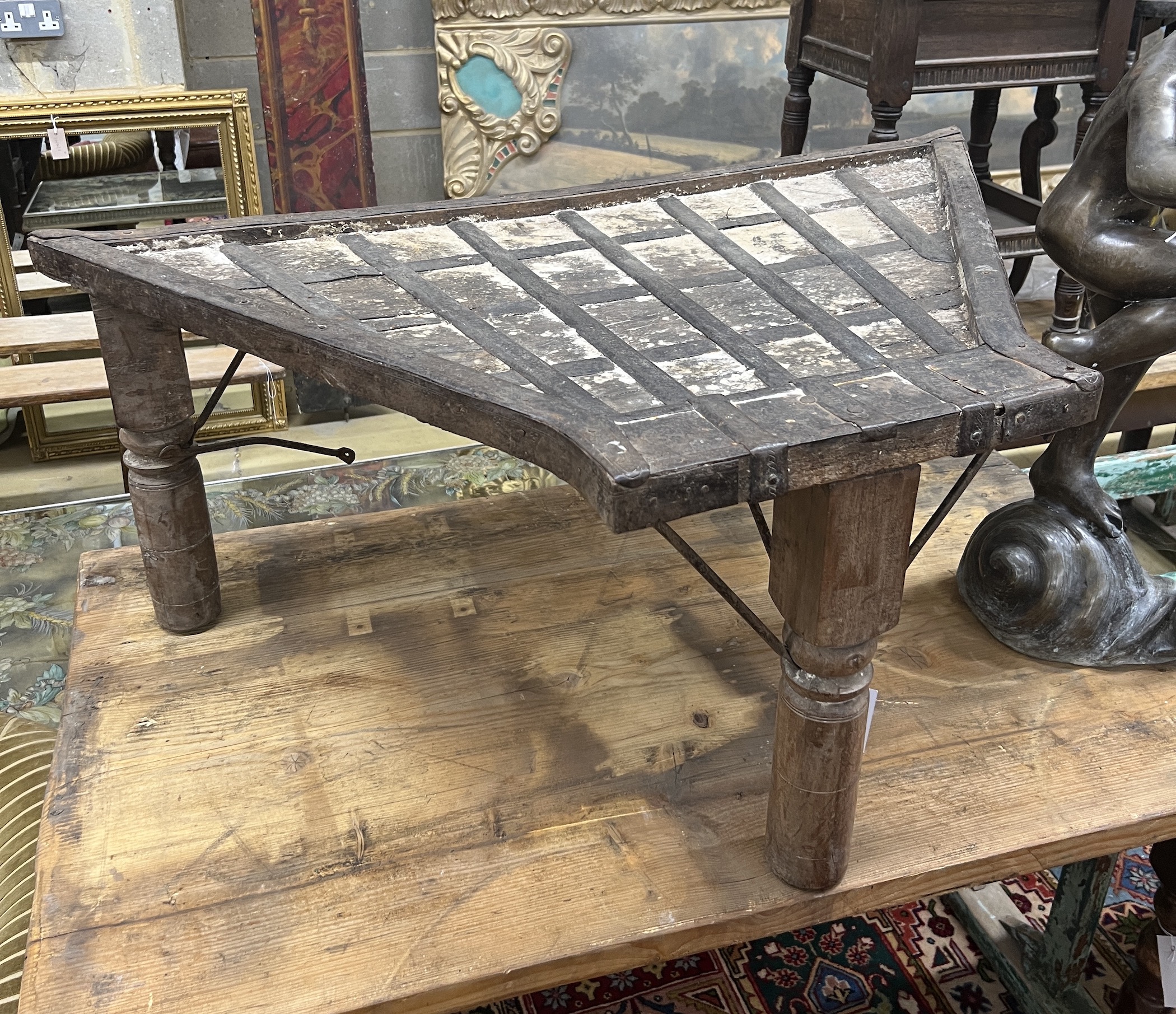 An Indonesian metal bound hardwood stand, width 104cm, depth 61cm, height 43cm